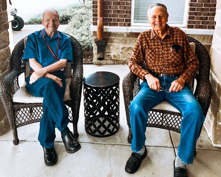 Residents enjoying time together in a bright community lounge